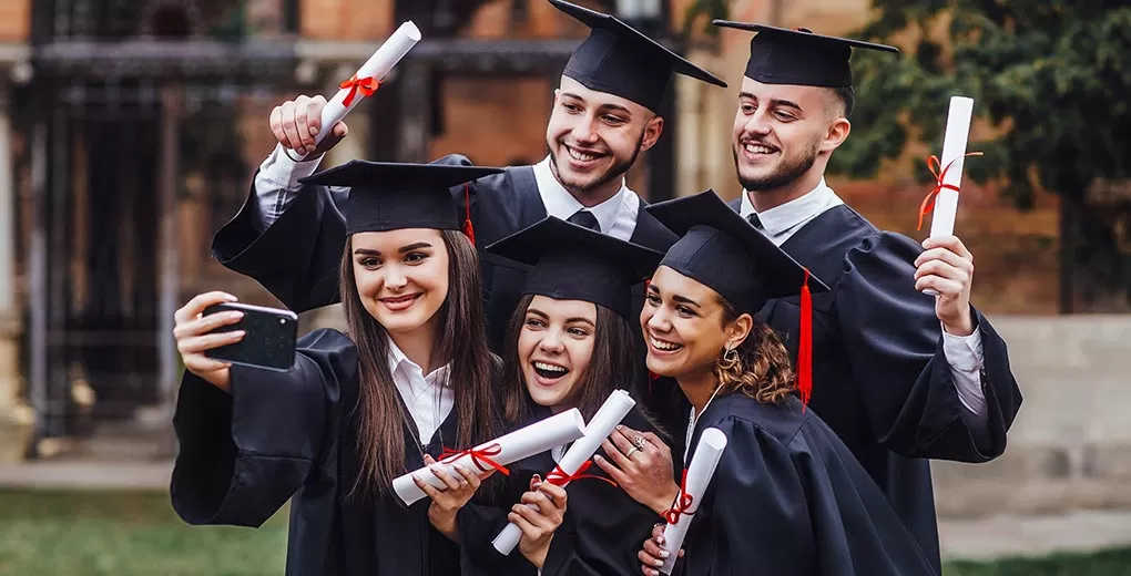 Graduates celebrating after completing university